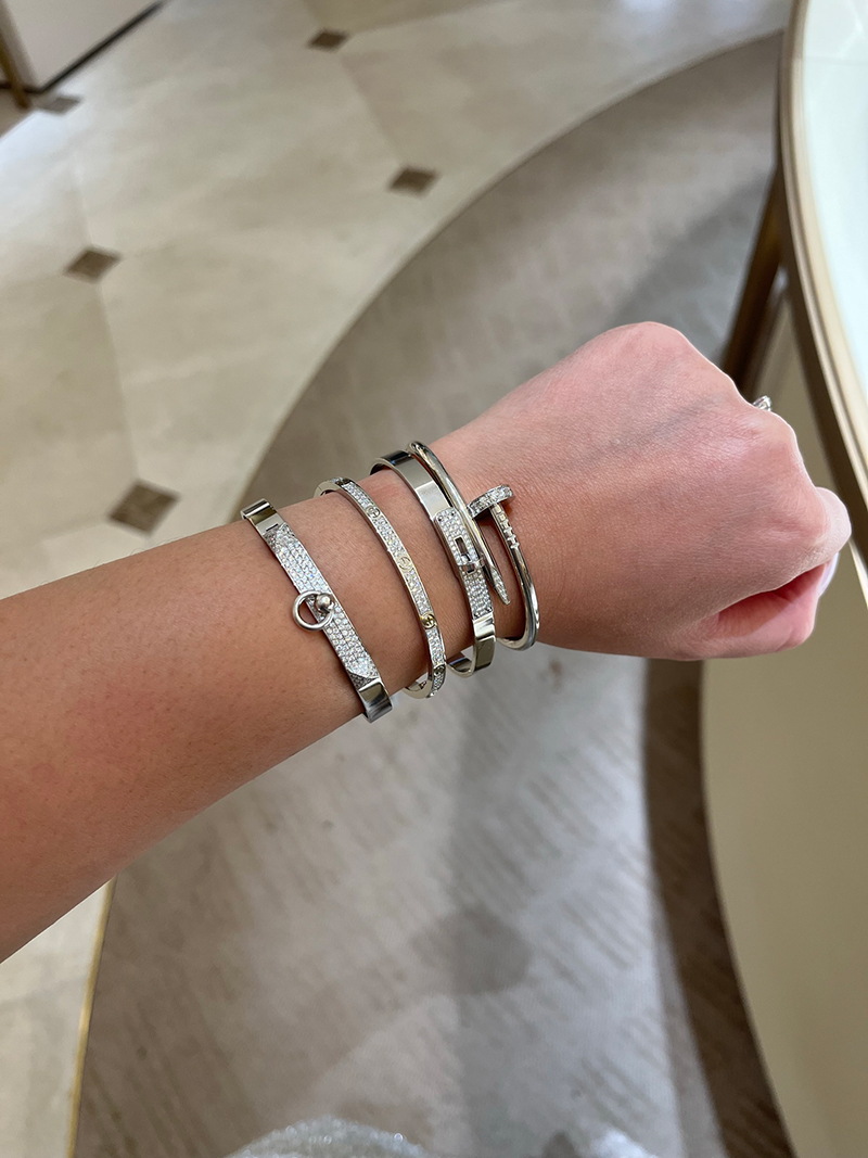 A fabulous white gold stack, mixing the Hermès Collier de Chien and Kelly Bracelets with a Cartier Love and Juste Un Clou. Photo via TPFer @Nashpoo.