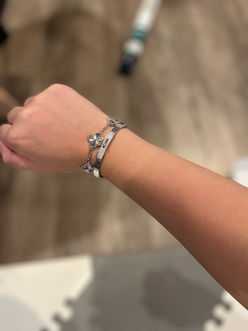 A White Gold and Diamond Kelly Bracelet stacked with a Van Cleef and Arpels Guilloche Bracelet. Photo via TPFer @Nashpoo.