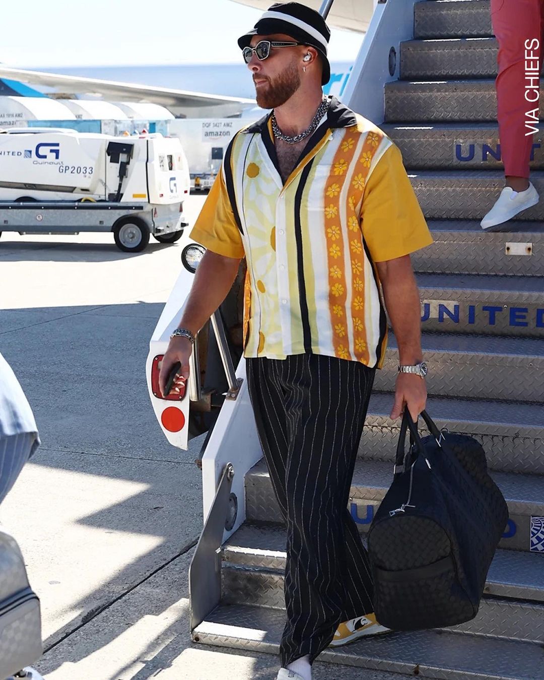 travis kelce louis vuitton bag