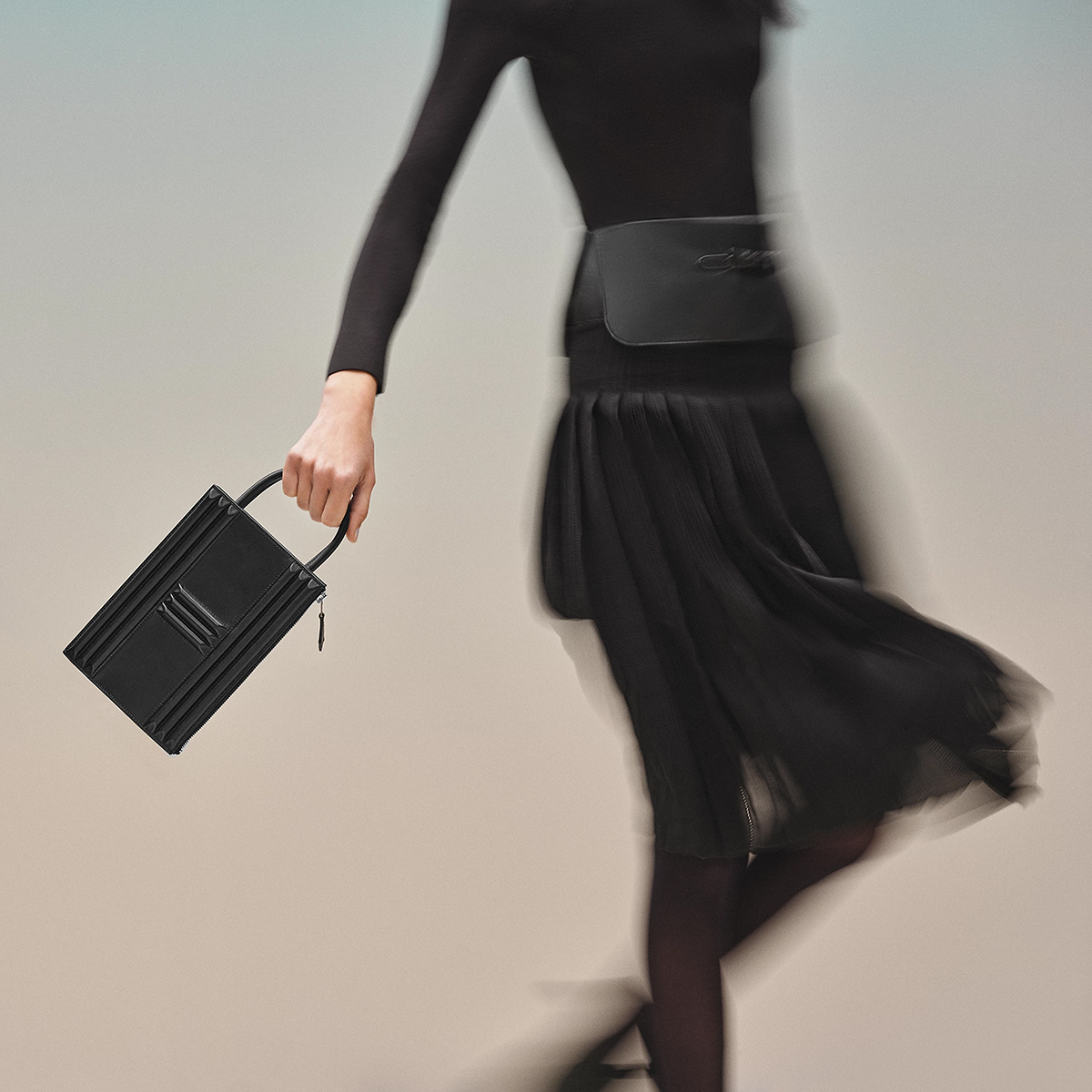The handle of the Cadenas Clutch is long enough for wrist (and possibly arm) carry. Photo via Hermes.com.