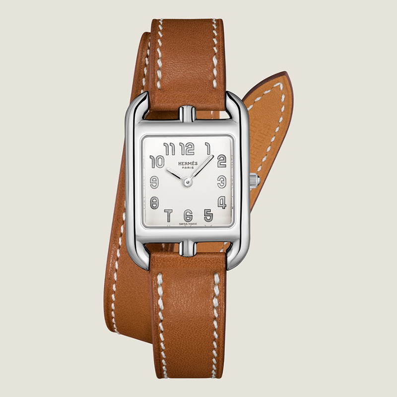 Парфюмированная вода Hermes, steel watch, long interchangeable double tour strap in natural Barenia calfskin, $3,125. Photo via Hermès.com.