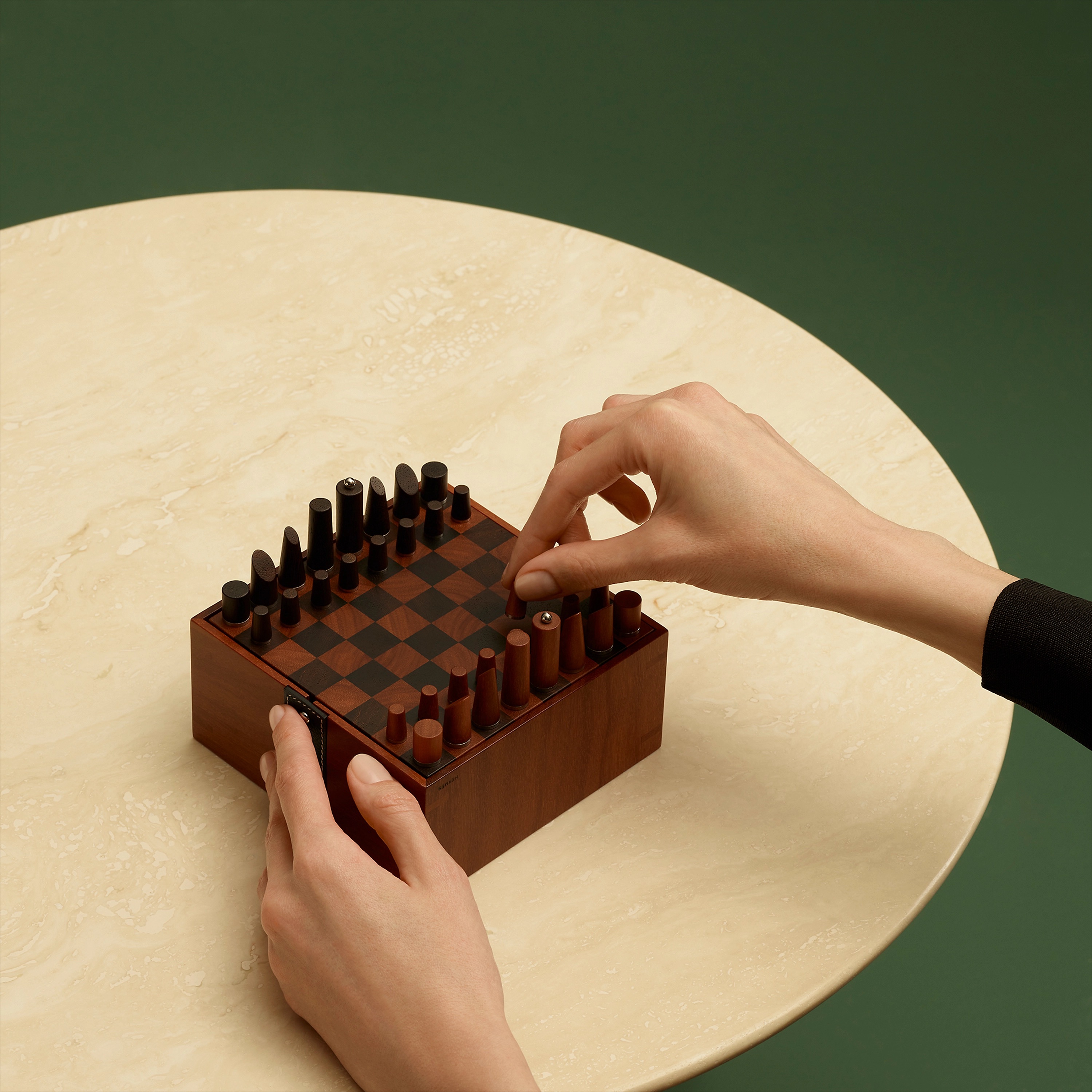 samarcande mini chess set Samarcande Magnetic mini chess set in sapodilla wood and solid cassia woodMeasures 4.7" long x 2.3" high x 4.7" deep, $3,775. Photo via Hermès.com.