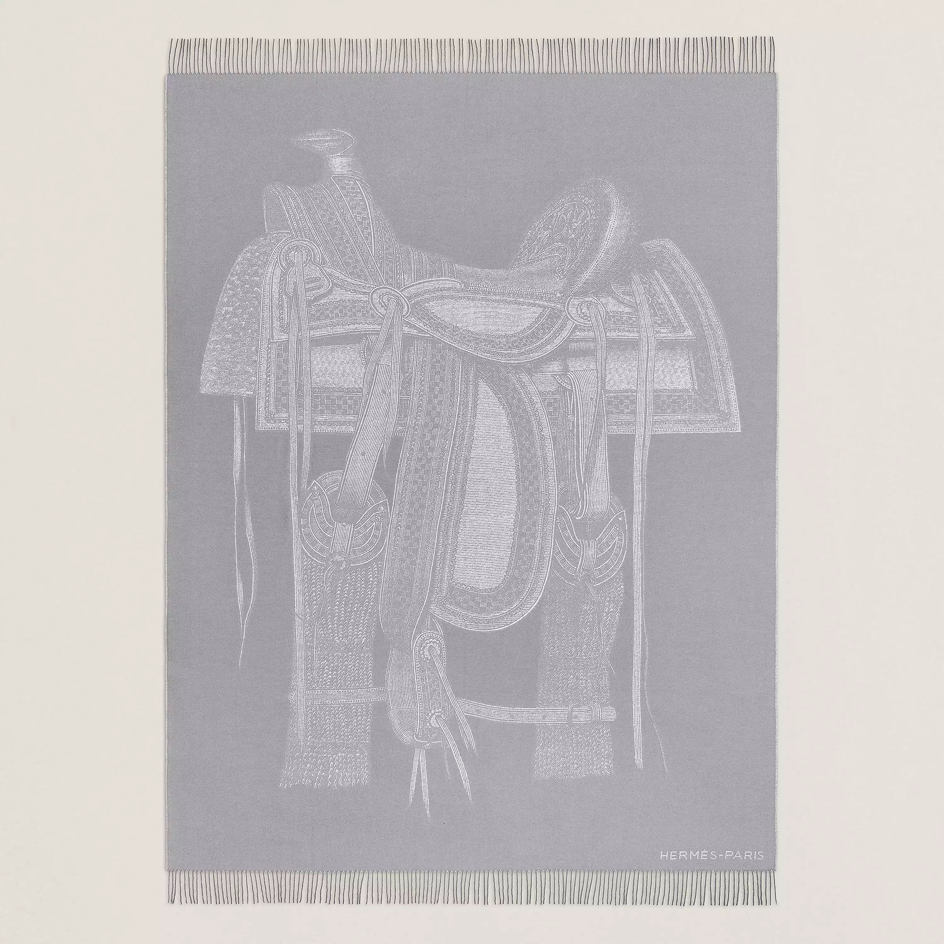 Selle Far West Blanket in jacquard woven cashmere and fringe finishing (100% cashmere). Measures 59.1" x 78.7" $3650. Photo via Hermes.com