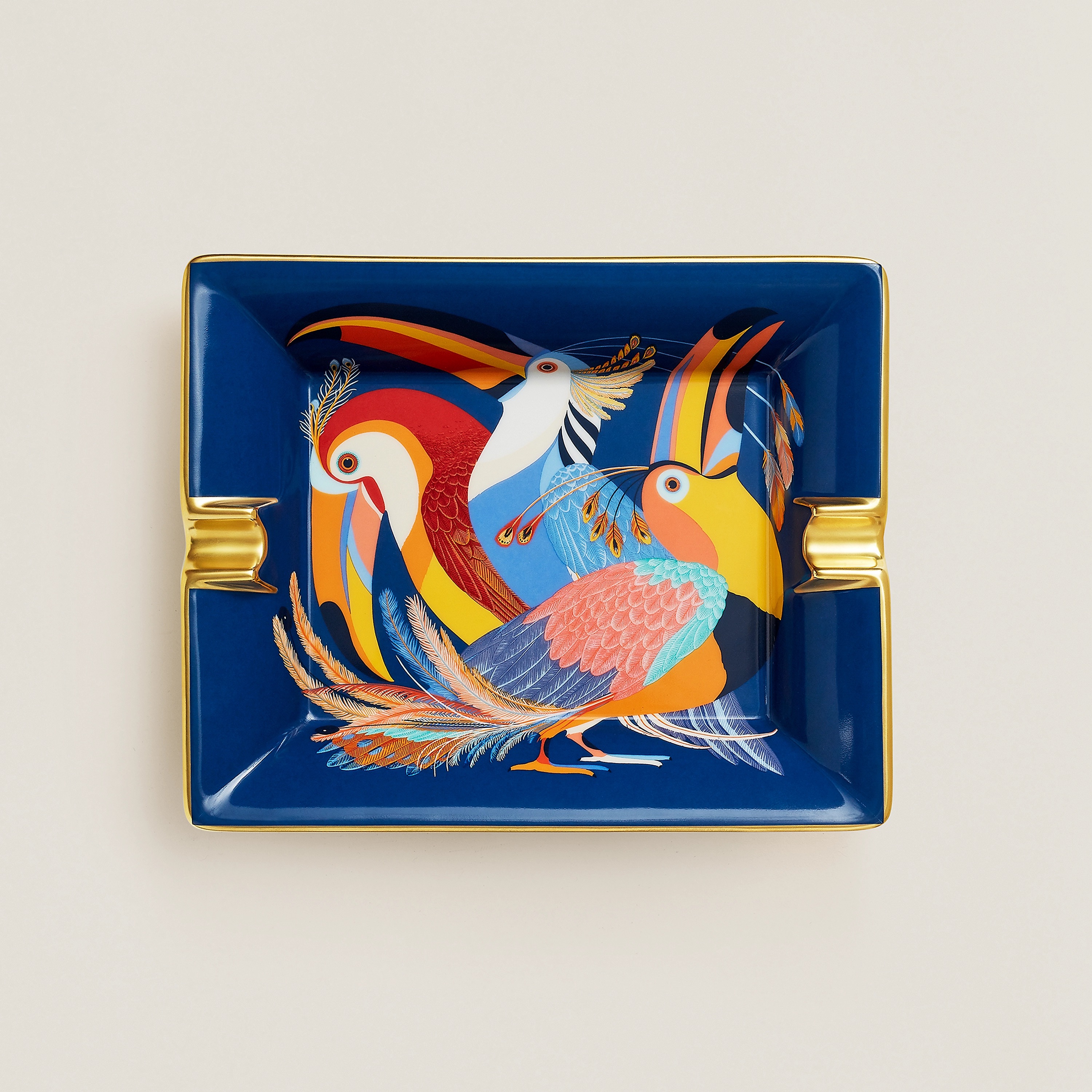 Toucans de Paradis ashtray in porcelain. Measures 7.9" long x 6.3" wide, $770. Photo via Hermès.com.