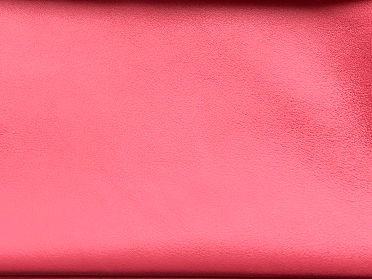 Swift in Rose Azalee. Up close, you can see that Swift has a slightly uneven tone, a very faint grain, and some softness.