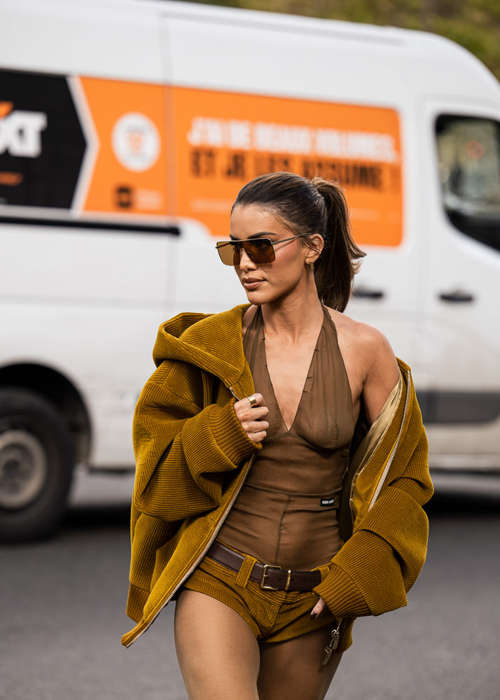 Milan, Italy - February, 25, 2022: woman wears pink Miu Miu Wander  Matelasse hobo bag in regenerated nylon, street style details Stock Photo