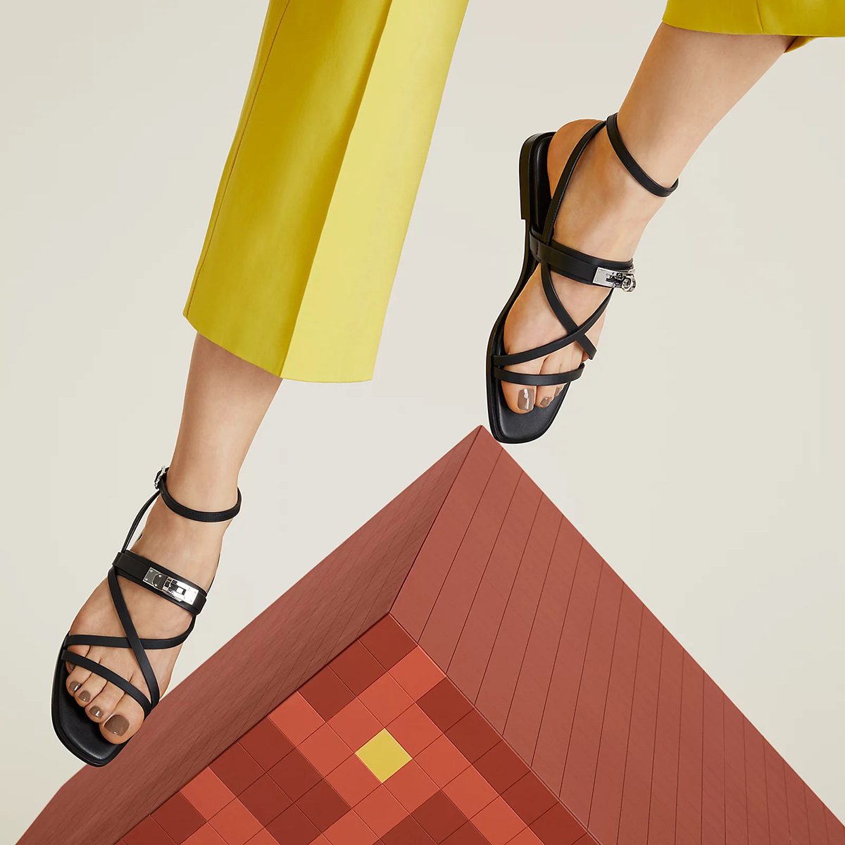 June Sandal in Noir Calfskin with Kelly Buckle in PHW. Photo via Hermes.com.
