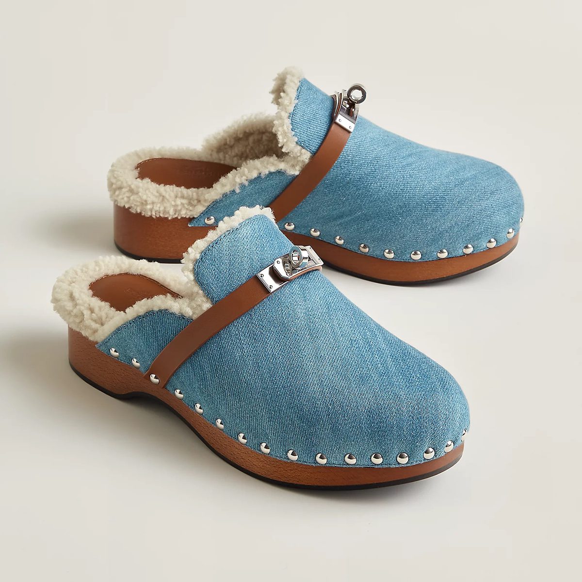 Carlotta Mule in Bleu Clair Denim and Naturel Calfskin with Wool Lining. Photo via Hermes.com.