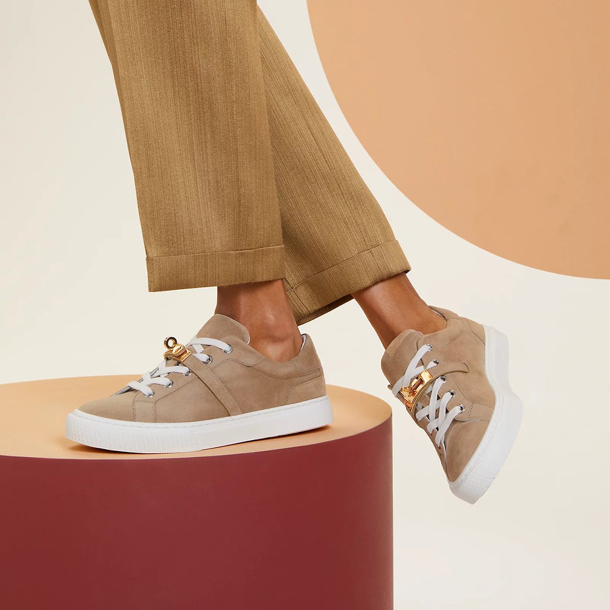 Day Sneaker in Beige Sable Suede Goatskin with Rose Gold Kelly Buckle. Photo via Hermes.com.