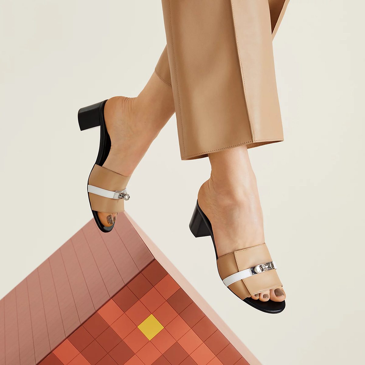 Gigi 50 Sandal in Beige Albinos and Blanc Calfskin. Photo via Hermes.com.