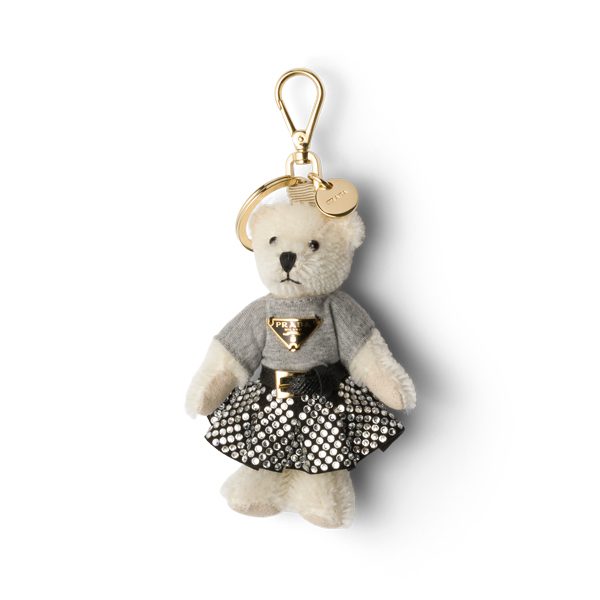 Playful Tricks Add a Whimsical Touch to the Iconic Prada Galleria This Season 9 Prada Teddy keychain charm white crystal