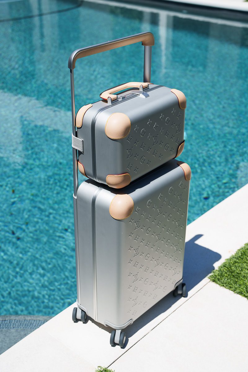 Louis Vuitton Horizon 55 and Vanity Case by pool
