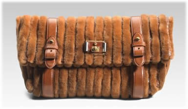 http://www.purseblog.com/images/marc-jacobs-monica-mink-python-clutch.jpg